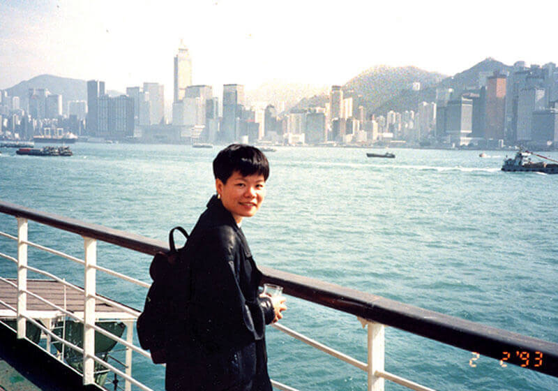 Ling set off from Hong Kong to Shanghai. The boat trip took her three days. Background is Wan Chai, Hong Kong, 1993